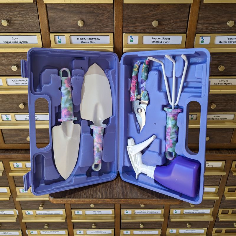 Open blue case with hand gardening tools, including trowels, snips, rake, and sprayer