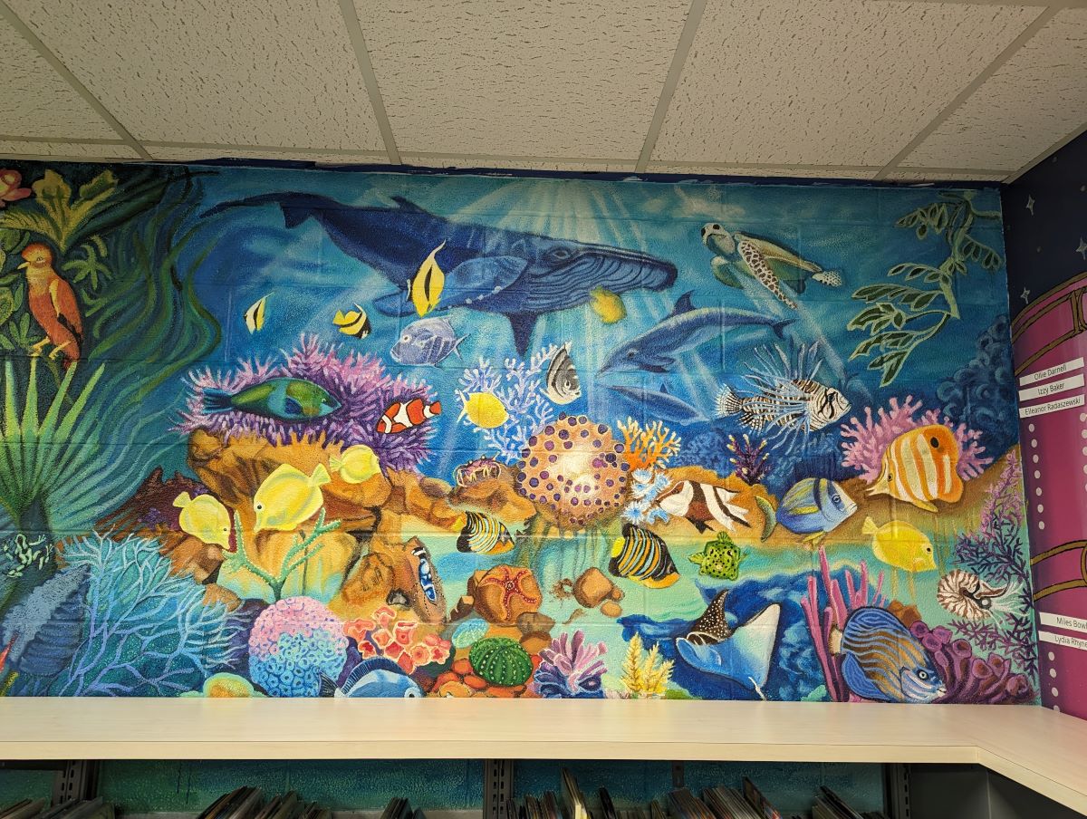 Colorful mural depicting animals in ocean ecosystem