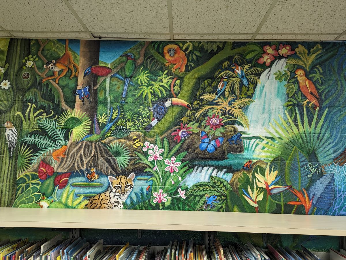 Colorful mural depicting animals in rainforest ecosystem