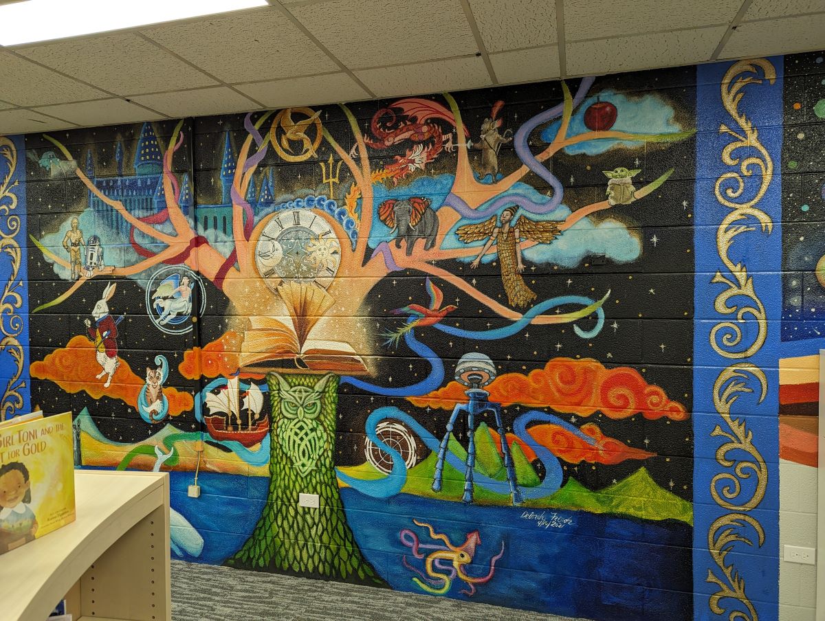 Colorful mural depicting fantastical tree with creatures and scenes from famous books