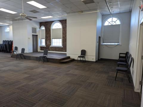 Corner angle view of Auditorium room with stage in center